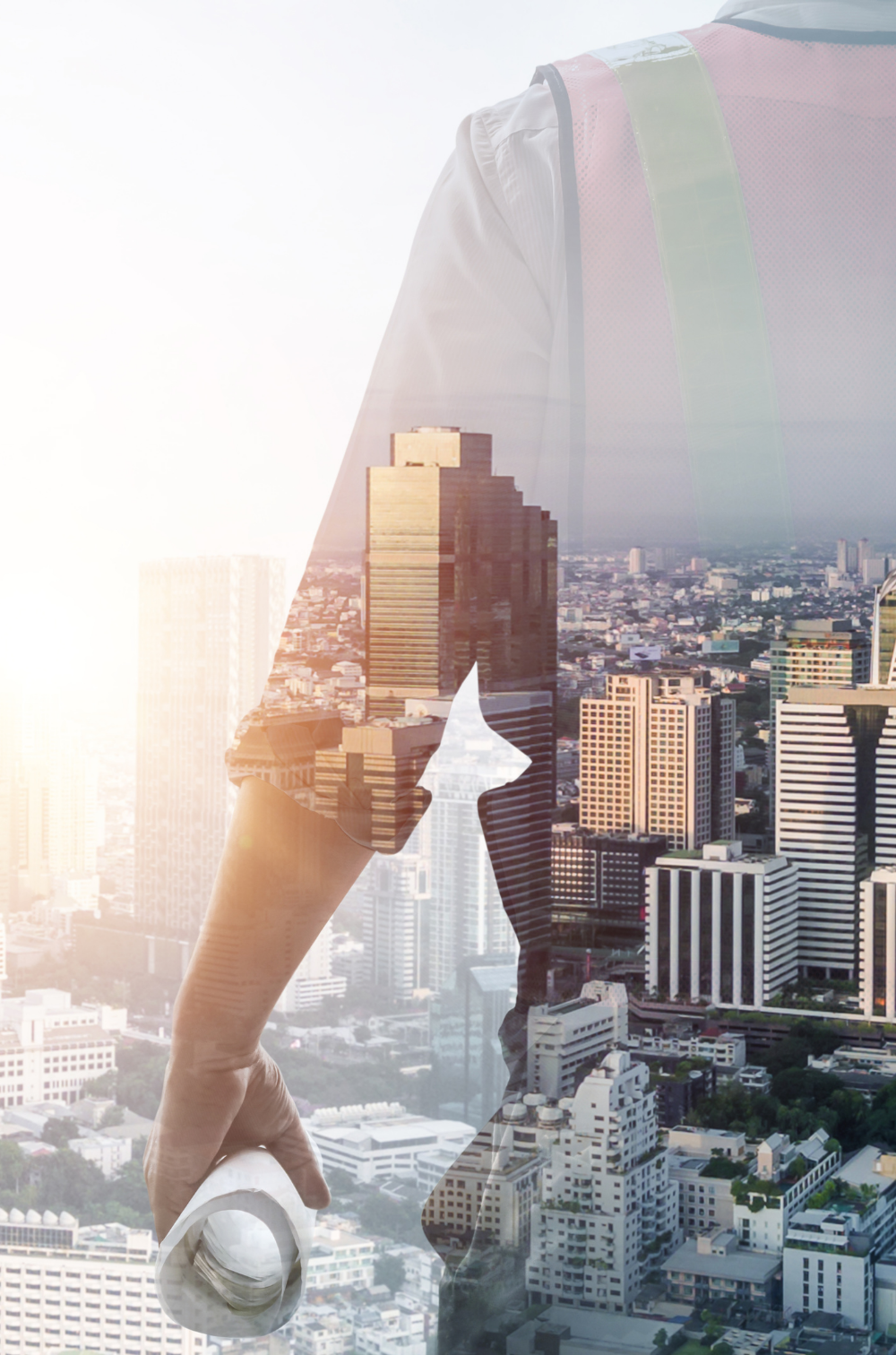 Engineer in a high-visibility vest holding rolled drawings, overlaid on a city skyline