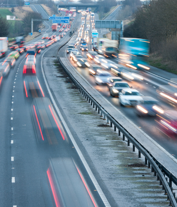 Busy motorway traffic at dusk on a dual carriageway